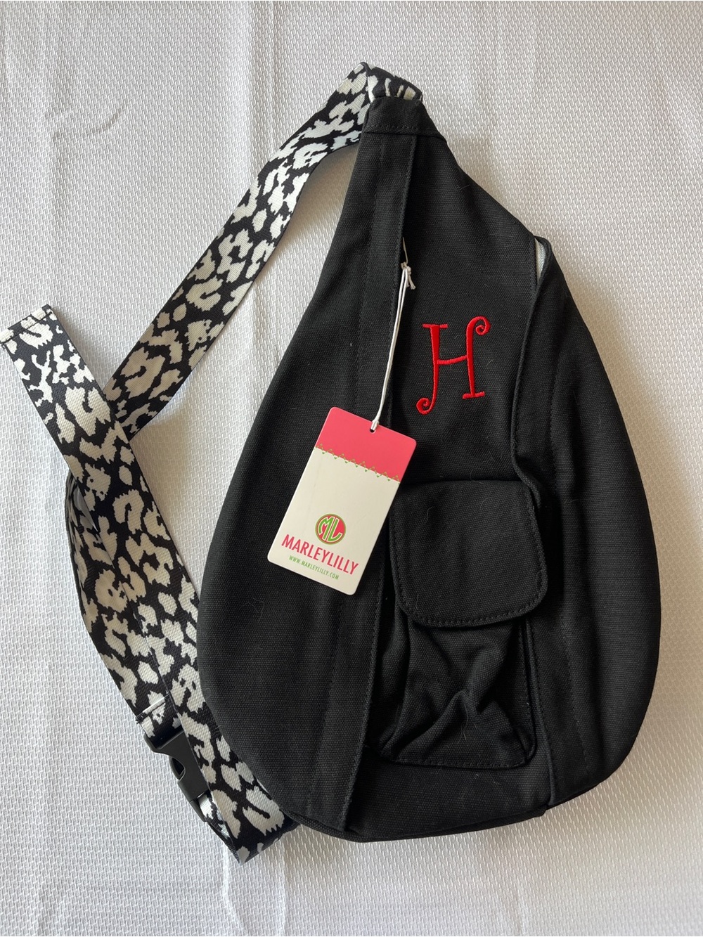 Marley Lilly Black Sling Backpack with Contrast Strap and Red Monogram H